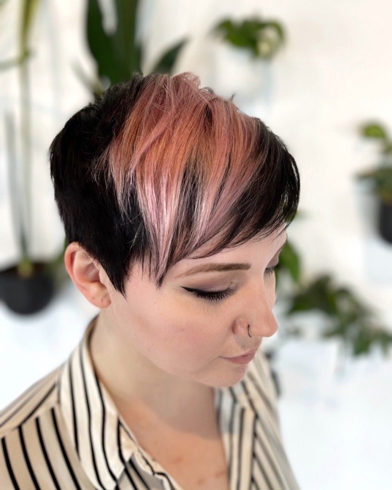 Pixie cut with a rose-toned fringe