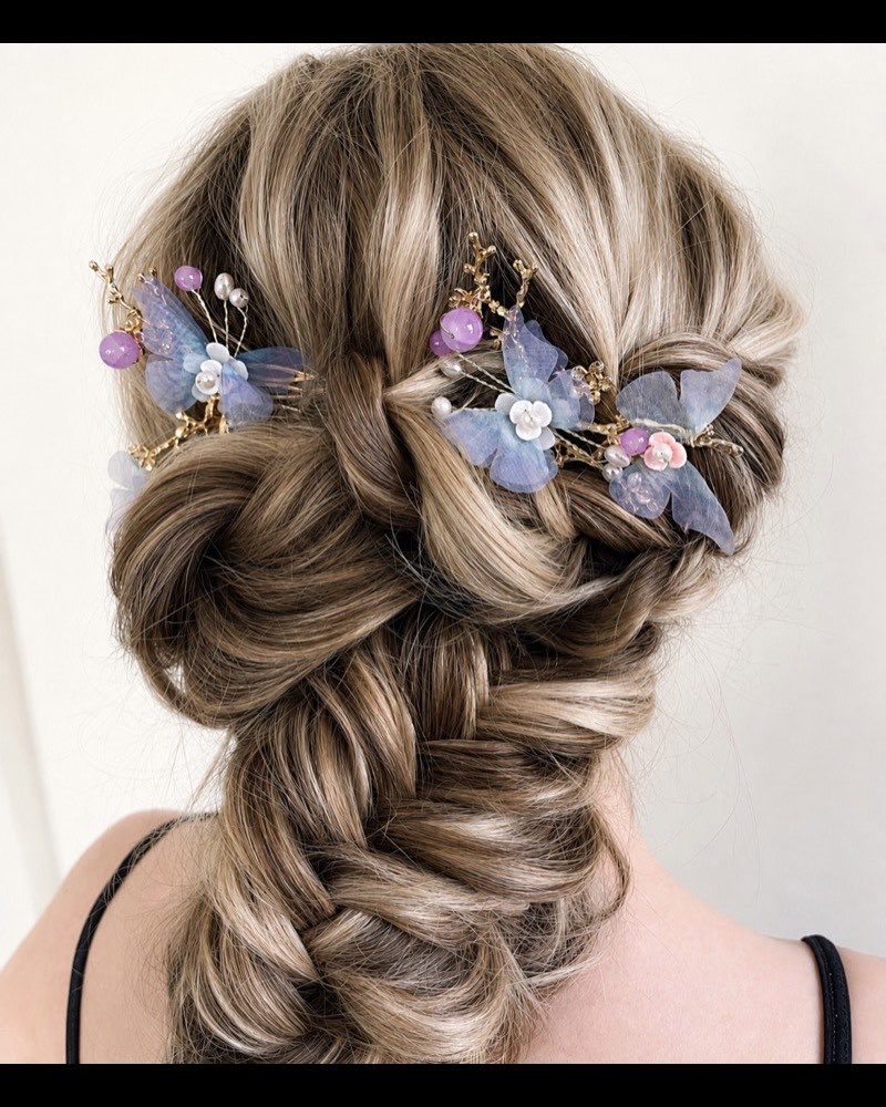 Braided bridal updo with floral pins