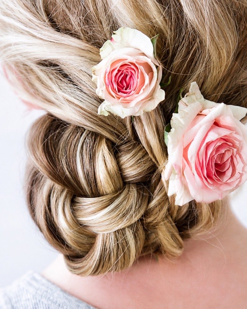 Braided updo dressed with roses